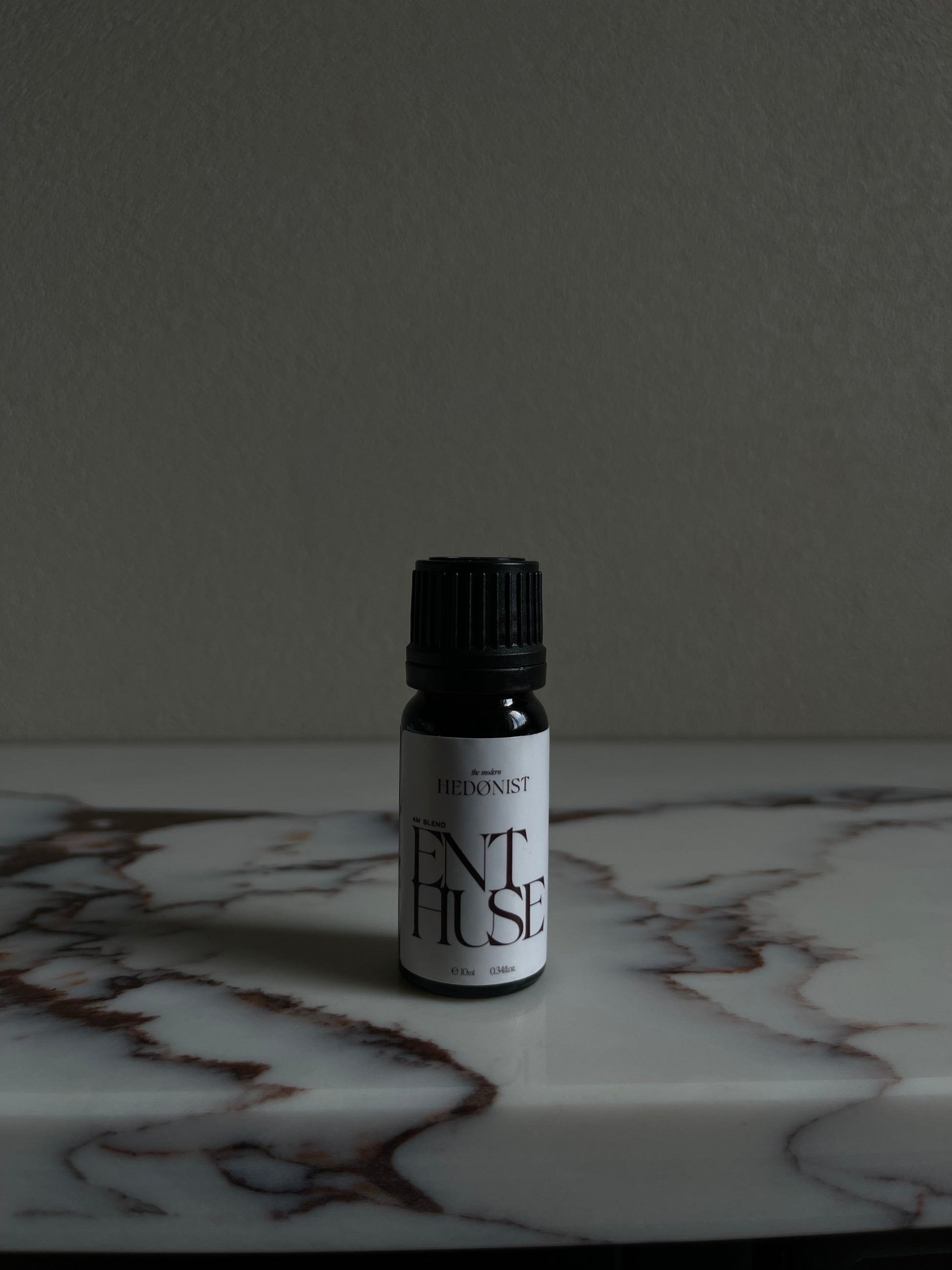 Enthuse positive essential oil on marble top